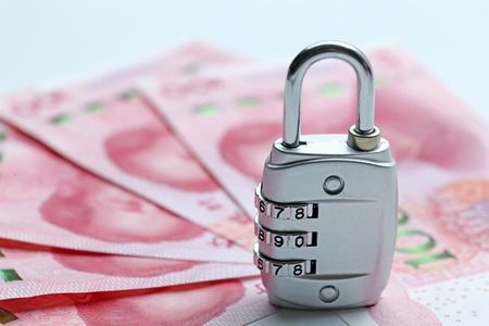 Financial security concept Password lock and banknotes on white background
