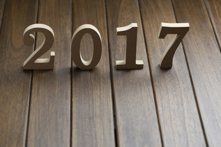 2017 happy new year, wooden numbers on retro wooden deskの写真素材