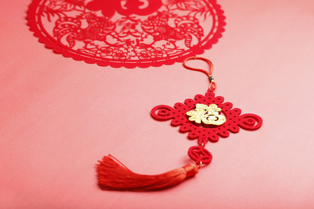 Chinese knot on red backgroundの写真素材