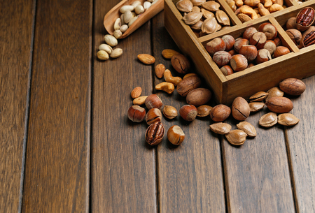 Various nuts in wooden boxの写真素材