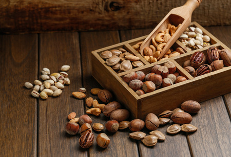 Various nuts in wooden boxの写真素材