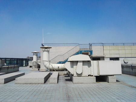 Ventilation duct on building roofの写真素材