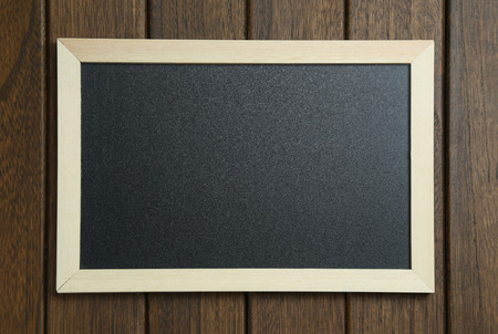 empty blackboard on vintage wooden background