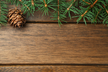 Merry Christmas background,pine branches and decorations on wooden table with copy spaceの写真素材