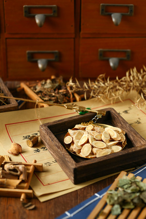 Chinese traditional herbal medicine in steelyard. Translation reads as chinese herbal therapy.の写真素材