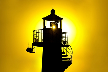 Lighthouse silhouetteat yellow sunset, Zadar, Croatiaの写真素材