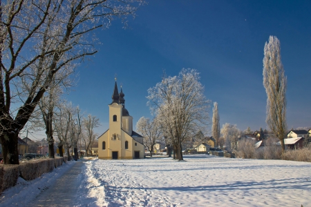 Idyllic winter - Church in snow, Krizevci, Croatiaの写真素材