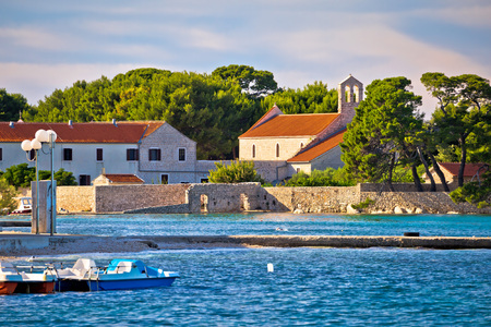 Ugljan island village old church and beach view, Dalmatia, Croatiaの写真素材