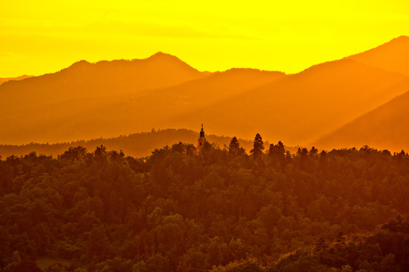 Hills above Ljubljana at yellow sunset view, capital of Sloveniaの写真素材