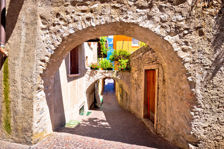 Old stone street of Limone sul Garda view, Lago di Garda, Lombardy, Italyの写真素材