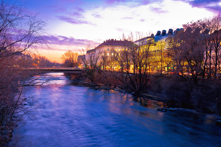 Mur river waterfront in Graz evening view, Styria region of Austriaの写真素材
