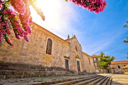 Blato on Korcula island historic stone square town lodge and church view, southern Dalmatia region of Croatiaの写真素材