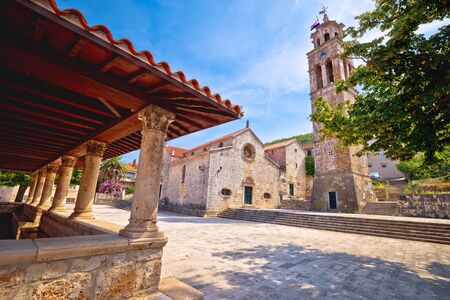 Blato on Korcula island historic stone square town lodge and church view, southern Dalmatia region...
