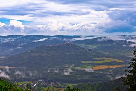 Istra. Green lanscape of Istria and hill town of Motovun fog view, scenic destination of Croatiaの写真素材