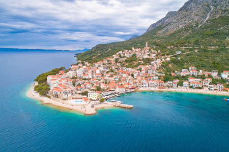Igrane village on Makarska riviera and Biokovo mountain aerial sea view, Dalmatia region of Croatia