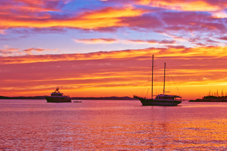 Zadar. Epic sunset at the sea yacht and sailboat view. Archipelago of Croatiaの写真素材