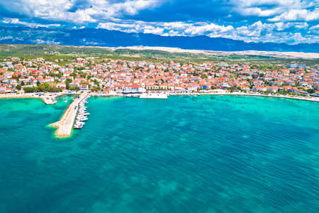 Town of Novalja beach and waterfront on Pag island aerial view, Dalmatia region of Croatiaの写真素材
