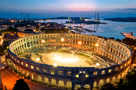 Arena Pula. Ancient ruins of Roman amphitheatre in Pula aerial evening view, Istria region of Croatiaのeditorial素材