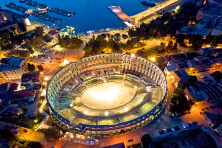 Arena Pula. Ancient ruins of Roman amphitheatre in Pula aerial evening view, Istria region of Croatiaのeditorial素材