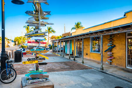 Key West distance marker and colorful street view, Florida Keys, United States of America