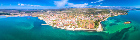 Coastal town of Posedarje waterfront and Velebit mountain aerial panoramic view, Dalmatia region of Croatiaの写真素材