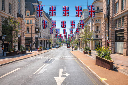 Regent Street Saint James in London scenic street view with UK flags, capital of United Kingdomのeditorial素材