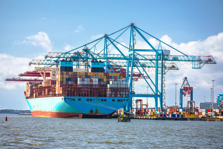 Container ship unloading cargo at Gothenburg terminal, cargo shipping in Sweden