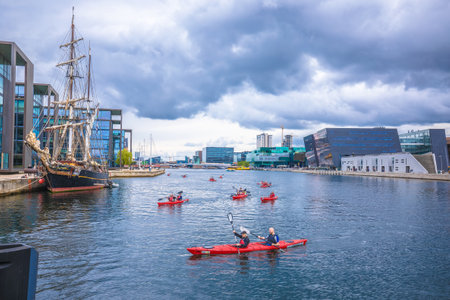 Copenhagen, Denmark, August 29 2023: People kayaking in canal in Copenhagen, capital of Denmark. Water recreation is famous activity in Scandinavian city.の写真素材
