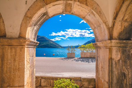 Kotor bay landscape through historic architecture arch, archipelago of Montenegroの写真素材