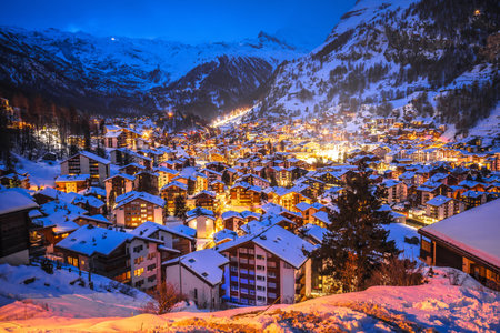 Idyllic village of Zermatt rooftops evening view, luxury winter destination in Switzerlandの写真素材