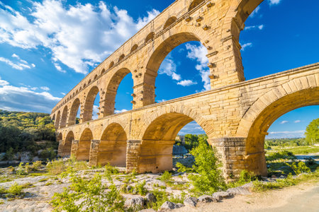 The Pont du Gard ancient Roman aqueduct bridge built in the first century AD to carry water to NÃ®mes. It crosses the river Gardon near the town of Vers-Pont-du-Gard in southern France.の写真素材