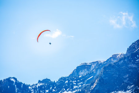Tandem paragliding in Switzerland Alps, outdoor leisure activity in Interlakenの写真素材