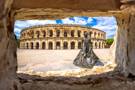 Nimes Amphitheatre historic landmark view through stone window, South of Franceの写真素材