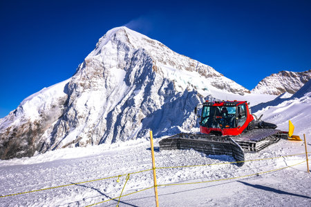 Ratrak snow plow on ski slope of Jungfraujoch peak view, Alps of Switzerlandの写真素材