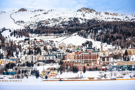 Town of Sankt Moritz luxury winter travel destination view from frozen lake, Graubunden region of Switzerlandの写真素材