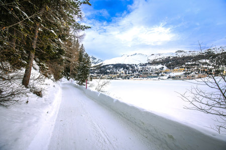 Town of Sankt Moritz view from frozen lake in winter snow, Alps in Switzerland
