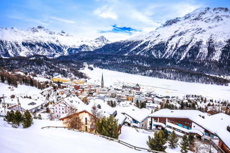 Town and frozen lake of Sankt Moritz luxury winter travel destination panoramic view, Graubunden region of Switzerlandの写真素材