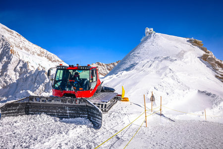 Ratrak snow plow on ski slope of Jungfraujoch peak view, Alps of Switzerlandの写真素材