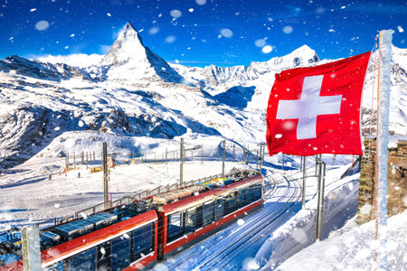 Matterhorn and Gorngerat cogwheel railway station in Zermatt ski area with Swiss flag view, Valais region in Switzerland Alpsの写真素材
