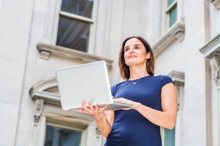 Young 40 years old Native American Businesswoman working in New York City, wearing short sleeve...