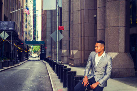 African American Businessman working, traveling in New York. A college student sitting on metal...