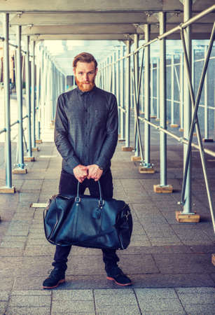 American man with beard, mustache traveling in New York, dressing in black, shirt, pants, shoes,...
