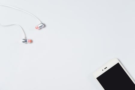 Smartphone and headphone on white backgroundの写真素材