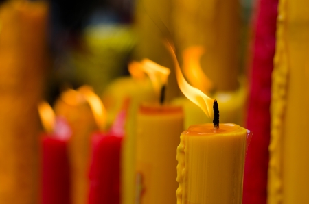 Red and Yellow candle in temple, Thailandの写真素材
