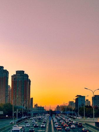 Sunset in the city. Traffic on the highway at sunset.の写真素材