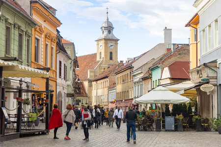 Brasov, Romania - 5 Nov 2023 - Visitors walking amidst restaurants on Strada Republicii. High quality photoのeditorial素材