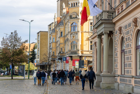 Brasov, Romania - 5 Nov 2023 - Visitors walking amidst restaurants on Strada Republicii. High...