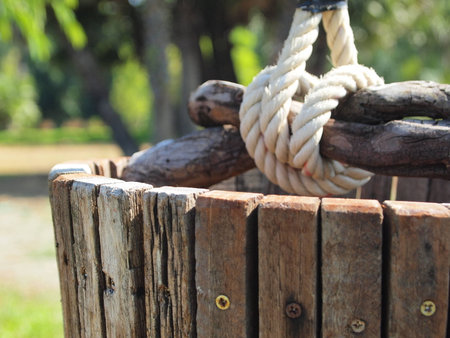 One wood bucket over the wellの写真素材