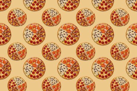 round juicy pizza with different fillings on an orange background Beautiful trendy pattern concept backgroundの写真素材