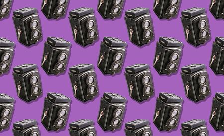 film camera with two lenses medium format on a purple background Pattern background